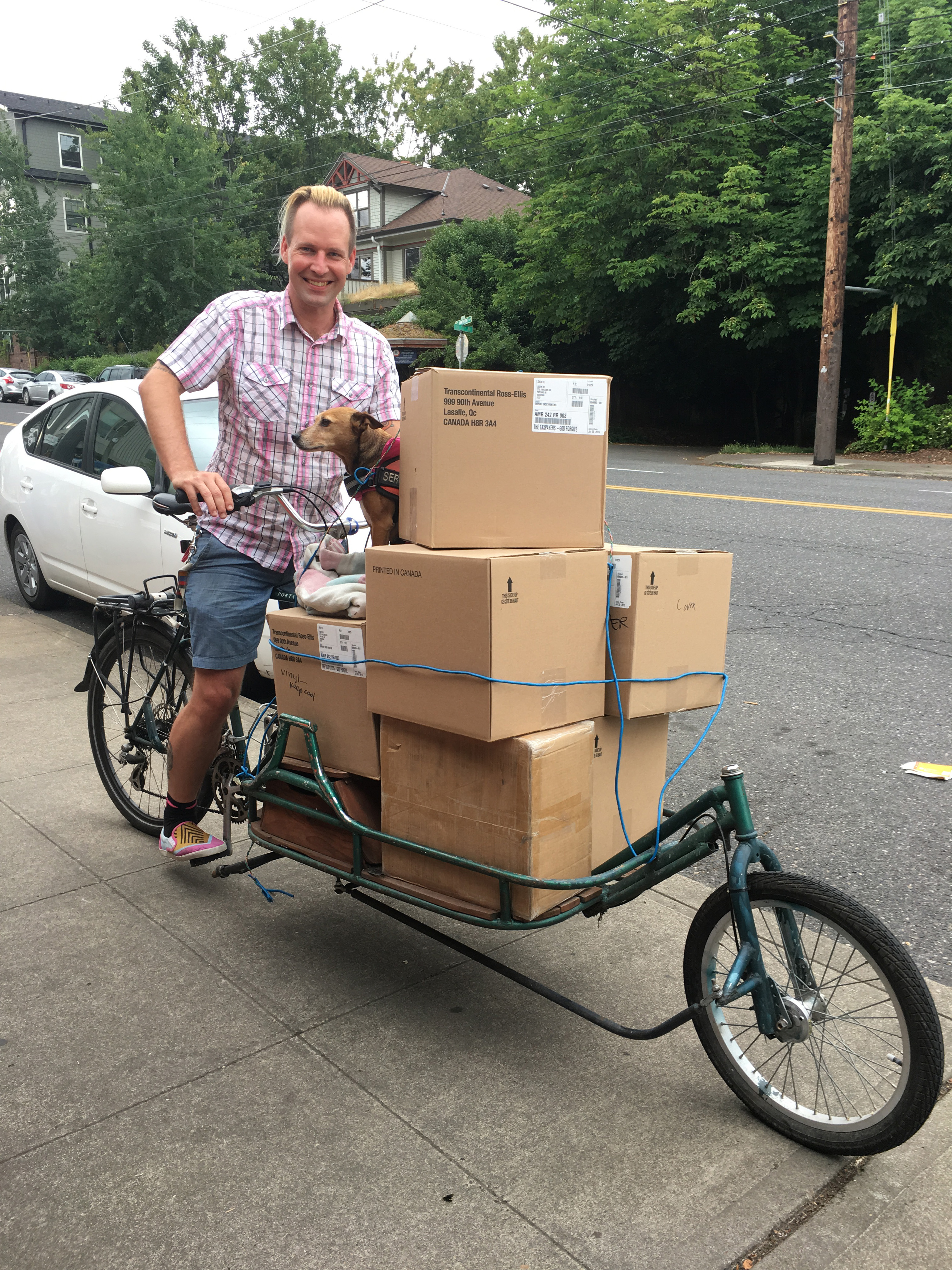 Joe Biel, publisher at Microcosm Publishing, running routine errands. Photo by Elly Blue.